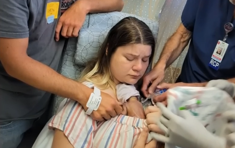 Hannah experiences skin-to-skin contact with Baby Samuel in hospital.