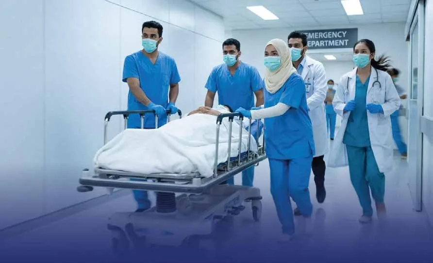 Doctors and nurses transporting a patient on a hospital stretcher through the emergency department during an urgent medical emergency
